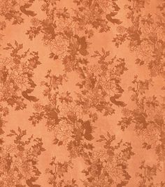 an orange floral wallpaper with birds and flowers on the back ground, in front of a brown background