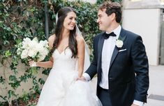 the bride and groom are walking together