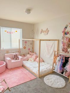 a pink and white girls'bedroom with teddy bears on the bed, rugs and toys