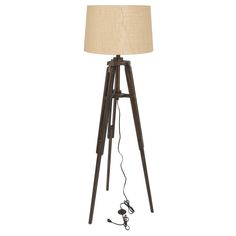 a floor lamp with a wooden tripod base