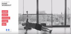 a woman is doing yoga in front of a window