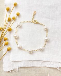 An ageless classic, this white freshwater pearl station bracelet is sure to become a go-to staple in any jewelry collection. Beautiful white cultured pearls on a textured, open-link chain give this piece an effortless, graceful style. Bracelet length:  7 inches plus 1 inch extender Materials:  gold fill, cultured freshwater pearls GIFTING ~ Jewelry gift box included. ~ I am happy to ship directly to the recipient.  Enter their address during checkout. ~ If you would like a gift note included in the package, please leave the text of the note in the "Add a note to Marsh Creek Jewelry" message box at checkout. FREE SHIPPING ~ Orders ship within 2 business days. ~ Free shipping is First Class ~ Priority Mail and Express Shipping upgrades are available during checkout. RETURNS ~ Returns accepte Elegant White Pearl Bracelet With Extender, Classic Pearl Bracelet With Extender For Gift, Everyday White Pearl Bracelet With Extender, Classic White Jewelry With Extender, Elegant White Hypoallergenic Pearl Bracelet, Elegant Hypoallergenic White Pearl Bracelet, Timeless White Pearl Bracelet For Anniversary, Classic Pearl White Hypoallergenic Pearl Bracelet, Classic Hypoallergenic Pearl White Pearl Bracelet