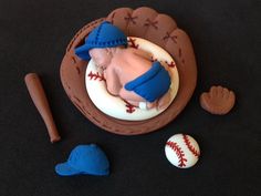 there is a cake with a baseball and bat on it