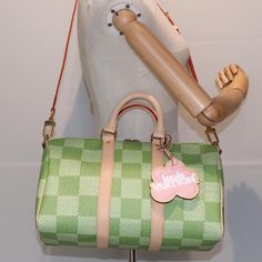 Brand: Louis Vuitton Model: Speedy Bandoulière 35 Color: Green Material: Canvas Inclusions: Dust Bag / Item Box / Shoulder Strap / Charm Dimensions: W35cm x H20cm x D16cm / Shoulder Drop:40 - 52cm Shoulder Drop 40 - 52cm Serial number: E0:16:3C:01:57:3F:52:EF Country of origin: France Condition: AB - good condition. The Louis Vuitton Speedy Bandoulière 35 in vibrant green Damier Color Canvas exemplifies the brand’s renowned French craftsmanship and stylish design. This elegant handbag combines l Designer Green Satchel Bag, Designer Green Bag With Removable Pouch, Designer Green Bags With Removable Pouch, Designer Green Bags With Leather Handles, Luxury Green Bags For Errands, Green Luxury Bag For Errands, Luxury Green Satchel With Adjustable Strap, Designer Green Shoulder Bag With Leather Handles, Luxury Green Satchel For Daily Use