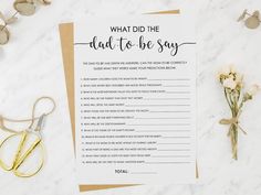 a printable what did the dad to be say card next to scissors and flowers