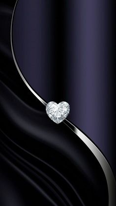 an elegant diamond ring on a shiny black background with wavy lines and curves in the foreground