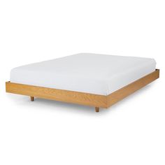 a wooden bed frame with white sheets and pillows on it, against a white background