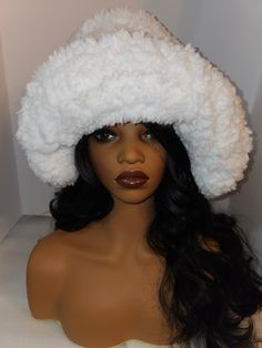 One Size fits most Introducing our exquisite white crochet oversized statement hat, a striking fusion of high-end fashion and cozy elegance. Handcrafted with the finest faux fur polyester, this one-of-a-kind masterpiece is designed for those with a penchant for luxury and a passion for unique, trendsetting style. Experience the unparalleled softness and embrace the captivating allure of this hat, a bold symbol of contemporary sophistication that sets you apart in the world of haute couture. White Faux Fur Winter Hat, Fluffy White Winter Hat, White Hat With Faux Fur Lining For Winter, White Winter Hat, One Size Fits All, White Winter Hat One Size, White Winter Hat With Faux Fur Lining, White Winter Hat One Size Fits All, White One-size Hat For Winter, White Fluffy Winter Hat