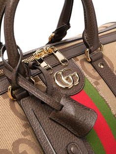 Jumbo GG duffle bag from Gucci featuring multicolour, calf leather, leather trim, gold-tone logo plaque, signature Web-stripe dial, monogram pattern, leather top handles, adjustable detachable shoulder strap, top zip fastening and main compartment. This item is in size UNI and the color is Beige Gucci Rectangular Satchel With Branded Hardware, Luxury Satchel Travel Bag With Zipper Closure, Luxury Satchel Travel Bag With Zipper, Gucci Satchel With Top Handle And Branded Hardware, Designer Satchel With Gold-tone Hardware For Travel, Luxury Duffle Bag Tote With Zipper Closure, High-end Travel Satchel With Branded Hardware, Gucci Brown Satchel With Gold-tone Hardware, Brown Gucci Satchel With Gold-tone Hardware