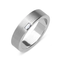 a men's wedding band with a baguette diamond set in the center