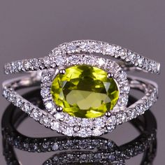 Our masterfully handcrafted Infinity ring consists of .38 carats of sparkling Diamonds intricately surrounding the vibrant colored 1.90 carat Peridot gemstone. This setting portrays the magnificent illusion of an endless stream of diamonds. Luxury Multi-stone Diamond Ring For Formal Occasions, Luxury Peridot Jewelry With Brilliant Cut, Luxury Peridot Rings In Fine Jewelry Style, Luxury Peridot Gemstones For Anniversary, Luxury Peridot Rings For Women, Diamond Infinity Ring, Lotto Winners, Halo Engagement Ring Wedding Band, Infinity Diamond Ring