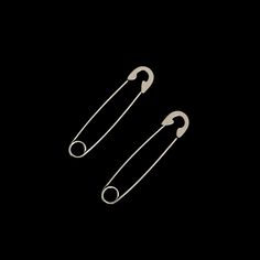 Sold as a pair, these safety pin shaped earrings are unique and edgy pair of earrings that can be worn multiple ways, through one piercing or through multiple piercings. These earrings are specifically made to be earrings and so the pin of these earrings are blunter and not as sharp as real safety pins.  The earrings are approximately 3.85cm long and 0.8cm wide.  These earrings are available in a spiked version: Vicious Spiked Safety Pin Earrings All our jewellery is made from stainless steel so they are 100% waterproof, tarnish-free and hypoallergenic. Safety Pin Tattoo, Pin Tattoo, Gothic Jewellery, Multiple Piercings, Pin Earrings, Safety Pin Earrings, Punk Grunge, Safety Pins, Birthday Jewelry Gift