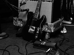 an electric guitar and amp are sitting on the floor