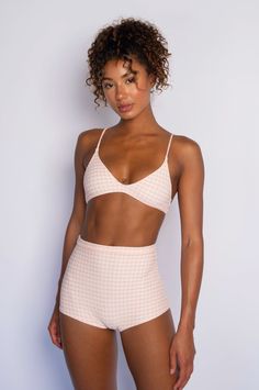 Details A super simple bralette with a gold clasp back that's chic and simple. This item is single-lined. Fabric: Jacquard Made in Los Angeles Click here for fabric details. Sizing SIZE BAND SIZE CUP SIZE RANGE XS 30-32 A/B 30A-32B S 32-34 B/C 32B-34C M 32-36 C/D 32C-36D L 32-40 D/DDD 32D-40DDD XL 32-40 DD/H 32DD-40H Model Measurements Anna is 5”10, Bust 32”, Waist 23.5”, Hips 34.5” Wears XS Tops, XS Bottoms, XS Clothes Kiele is 5'9, Bust 32.5", Waist 25", Hips 36.5" Wears XS Tops, XS Bottoms, X Chic Triangle Top Beach Bra, Chic Triangle Top Bra For Beach, Chic Summer Bra With Removable Pads, Chic Beach Bra With Triangle Top, Chic Bra With Removable Pads For Summer, Chic Fitted Triangle Top Bra, Chic Seamless Bra For Spring, Chic Cropped Bra With Removable Pads, Chic Summer Bra