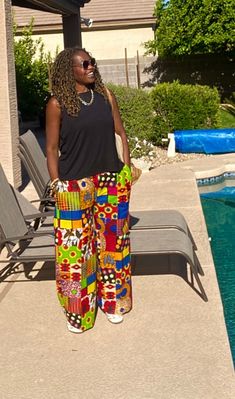 New loose African print pants, wide-leg made from African prints 100% cotton with no stretch. Our Ankara pants for women are very versatile, easy to wear, and comfy style. These African wax pants will be made loose fit for you upon ordering.   Features hidden side pockets. *Listing is for pants ONLY* Click below for the matching top:  https://www.etsy.com/listing/1322210044/mani-linen-kimono-linen-kimono-robe?click_key=6d282701f5fcd54db69a73a37cc3fa815256bb5b%3A1322210044&click_sum=16d87e3d&ref=shop_home_active_6&frs=1&sts=1 MEASUREMENT GUIDE:  For your best fit please provide: Waist measurements=Measure around your natural waist. Hip measurements= Inseam=Take your inseam by measuring between your crotch and hem. Your Height= - [ ] Orders; Once your order is placed with us, you will receiv Casual Multicolor Wide-leg Harem Pants, Baggy Wide Leg Printed Pants, Summer Wide Leg Pants With Pockets In Multicolor, Summer Multicolor Wide Leg Pants With Pockets, Casual Wide Leg Printed Pants, Multicolor Relaxed Fit Wide Leg Pants, Multicolor Vacation Pants With Pockets, Multicolor Wide-leg Pants With Elastic Waistband, Multicolor Ankle-length Wide Leg Pants With Elastic Waistband