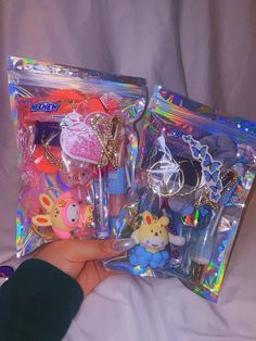 The Cutest Keychain 😻Lip Gloss Bundle with All Your Favorite Beauty Items! 🤍 It includes: ✨ 3 Gloss (Kitty, Lip Plumper..etc)  ✨ 1 Keychain  ✨ 1 Stainless Steel Earring (*hypoallergenic* doesn't cause allergies) ✨ 2 Hair Pins (Gold) ✨ 1 Scrunchie ✨ Candies (Hi Chew, Dumdums, Airheads..etc)   ✨ Stickers This bundle is available in:  Blue, Pink, Yellow NOTE: Every bundle may include slightly different items. The scrunchies, hair clips, and stickers may vary in color or style for example.  🚨 Bef Goodie Basket, Lip Gloss Bundle, Hi Chew, Scrunchies Hair, Best Small Business Ideas, Beads Bracelet Design, Cute School Supplies, Perfect Stocking Stuffers, Cute Keychain