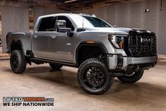 a silver truck is parked in a garage