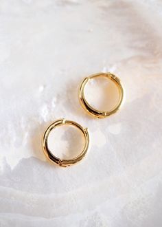 Small Gold Huggie Hoop earrings for everyday. These basic gold hoop earrings are just a little bit larger and tiny bit thicker than our bestselling Tiny Huggie Hoops, the Auli'i. But these are just as dependable, comfortable, and stunning for everyday. Grab them now. You need them in your life.✦ Pair them with our Dome Huggies  ➤ https://www.etsy.com/listing/877841117✦ DETAILS ✦✧ Name: Noelani - (noeh LAH nee) - Heavenly mist.✧ 14mm x 3mm thick 18kt Gold Filled Hoops.✧ 10mm Inner Diameter✧ All K Gold Huggie Hoop Earrings, Gold Hoop Earring, Hawaii Jewelry, Earrings Gold Hoop, Small Gold Hoop Earrings, Small Gold Hoops, Minimal Earrings, Gold Filled Hoops, Initial Jewelry