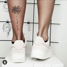 a woman's legs with tattoos on them