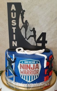 a cake decorated with an american ninja warrior logo