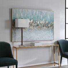 a living room with two chairs and a large painting on the wall above it's console table