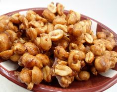 a plate filled with nuts on top of a table