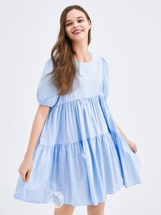 Details: Refined soft fabric. Loose fit. Puffed sleeve. Materials & Care: 100% Cotton Machine wash | Gentle dry clean Do not bleach Size & Fit: Model is 5'8", Bust 30, Waist 24, Hips 36, wearing a size S Item #: LK2DR206B Casual Solid Color Tiered Dress, Spring Knee-length Bubble Dress With Ruffles, Billowy Bubble Hem Summer Dress, Spring Cotton Bubble Hem Dress, Spring Bubble Hem Cotton Dress, Spring Cotton Dress With Bubble Hem, Flowy Light Blue Mini Dress With Ruffles, Light Blue Flowy Mini Dress With Ruffles, Spring Light Blue Solid Mini Dress