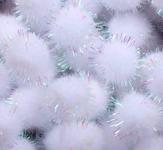 many white fluffy balls with sparkles on them