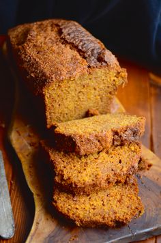 sliced loaf of pumpkin bread sitting on top of a cutting board