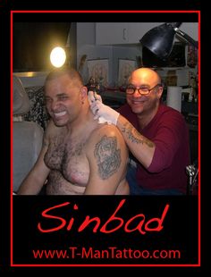 a man getting his tattoo done by another man in a room with the words sinbed on it