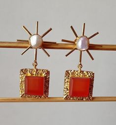 Pearl and Carnelian Earrings, 18k Gold Plated Earrings | Pearl Earrings| Carnelian Earrings | Dainty Gift | Christmas Gifts, Wedding Jewelry 18k Gold Plated Handmade Jewelry Earring length  = 57 MM  Earring width    = 29 MM Important Care Tips: We recommend taking your jewelry off for the shower, pool or spa. Also remove when sleeping or exercising and avoid contact with perfume and chemicals. For cleaning we recommend using a soft lint free cloth.  Please store in a cool dry place.  Please feel Gold Carnelian Gemstone Earrings, Elegant Gold Carnelian Earrings, Elegant Carnelian Drop Earrings, Elegant Carnelian Earrings Gift, Elegant Carnelian Earrings For Gift, Elegant Orange Carnelian Earrings, Gold Carnelian Jewelry With Matching Earrings, Gold Rectangular Pearl Earrings Gift, Gold Rectangular Pearl Earrings For Gifts