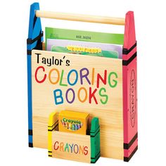 a wooden toy book holder filled with books and crayons on the front cover