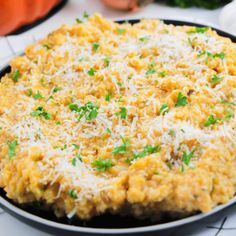 a pan filled with food sitting on top of a table