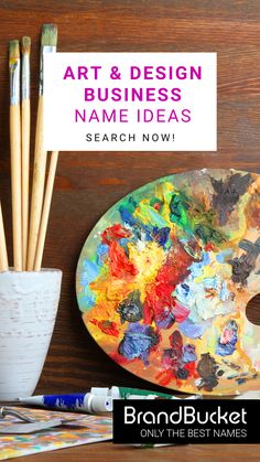 an art and design name idea with paintbrushes in front of it on a wooden table