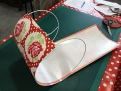 a paper crown sitting on top of a table next to scissors and other crafting supplies