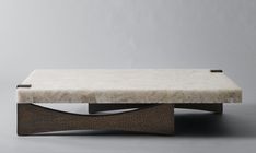 a marble and wood coffee table sitting on top of a gray floor