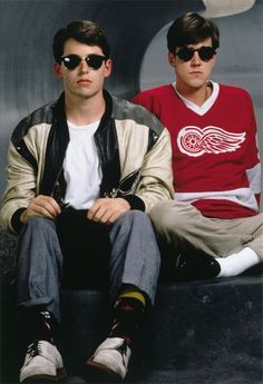 two young men sitting next to each other