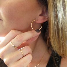 "These delicate hand crafted 14k gold filled, sterling silver, or rose gold filled hoops are hand shaped, filed, forged and polished to a glittering finish. The high quality metal will never turn no matter how much you wear them - just clean them with some windex or warm soapy water and they're good to go! They measure 1\" in diameter, are virtually weightless, and close with a loop in the back. These earrings are in it for the long haul : we only use high quality 14k gold filled and rose gold f Delicate Everyday Hoop Jewelry, Dainty Hoop Jewelry For Everyday, Delicate Yellow Gold Hoop Jewelry, Everyday Hammered Huggie Jewelry, Everyday Hoop Jewelry In Recycled Gold, Hypoallergenic Rose Gold Hoop Earrings In 14k Gold, Delicate Small Hoop Yellow Gold Jewelry, Dainty Small Hoop Jewelry For Everyday, Dainty Small Hoop Everyday Jewelry