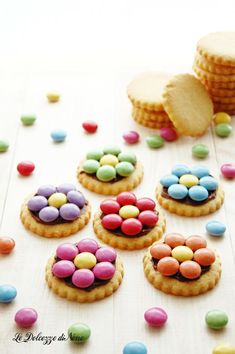 some cookies with candy on top of them and the words dolce desert biscotti