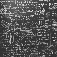 a blackboard with lots of calculations written on it and writing all over the board