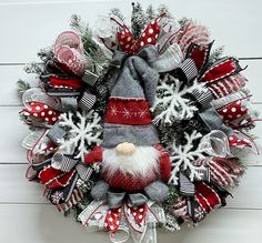 a christmas wreath with santa claus on it