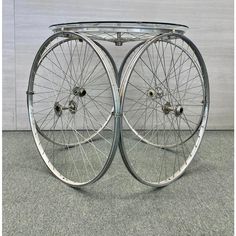 two bicycle wheels sitting on top of each other