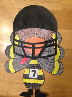 a paper cut out of a football player with the number seven on it's face