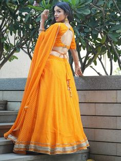 <ul>
<li><span data-preserver-spaces="true">Create a magnificent effect with your fashion sense by wearing this unique orange color lehenga made of georgette material beautifully embellished with an all-over laheriya print and Gotta patti lace work.</span></li>
<li><span data-preserver-spaces="true">This lehenga comes in a similar color choli in a georgette material design with all-over laheriya print work and a georgette material dupatta featured with a Haldi Wear, Georgette Material, Bridesmaid Lehenga, Party Wear Lehenga Choli, Gotta Patti, Lehenga Choli Online, Indian Wedding Wear, Party Wear Lehenga, Designer Lehenga Choli