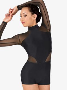 a woman wearing a black bodysuit with sheer sleeves