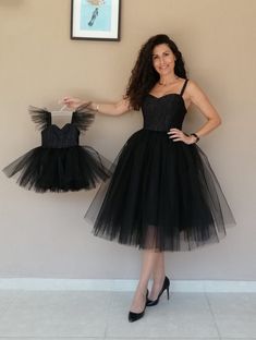 "This mother daughter matching tutu set would be perfect for birthdays, mother's day, parties and family pictures, holidays or just that. Upper and lower body one-piece dress, upper body stretch fabric. Satin lining is used under the tulle. Please choose your size by looking at the measurements. Mom Sizes: SIZE S: Bust 86cm, Waist 70cm SIZE M: Bust 90cm, Waist 74cm SIZE L: Bust 94cm, Waist 78cm Mother Dress length (S/M/L from shoulder to knee) 115cm For children's sizes, please refer to the size chart. Our size patterns are standard. For example, if your daughter is 2 years old and she is 2 years old in height and weight, you should choose a size 2 years old. Children's Dress Lengths (from shoulder to knee): 1 year 43 cm, 2 years 48 cm. 3 years 52cm, 4 years 56cm, 5 years 61cm, 6 years 65c Upper Body Stretch, Mom Daughter Dress, Mother And Daughter Dresses, Black Tutu Dress, Mother Daughter Dresses, Mommy And Daughter, Mother Daughter Dresses Matching, Dress Glitter, Mother Dress