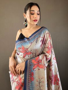 The cream and blue silk saree adorned with exquisite Kalamkari print work and delicately attached tassels on the pallu. With 5.50 meters of sheer elegance, this saree is poised to elevate your wardrobe, infusing it with the breezy vibrancy of the season and ensuring you stand out at every upcoming festival, occasion, or special function.
The combination of cream and blue hues creates a mesmerizing contrast that exudes both tranquility and vibrancy, while the intricate Kalamkari print work adds a Elegant Kalamkari Print Dupatta In Traditional Drape, Unstitched Elegant Kalamkari Blouse Piece, Elegant Festive Saree With Kalamkari Print, Elegant Kalamkari Print Dupatta, Elegant Kalamkari Print Saree For Diwali, Elegant Art Silk Saree With Kalamkari Print, Elegant Multicolor Saree With Kalamkari Print, Elegant Unstitched Dupatta With Kalamkari Print, Elegant Multicolor Kalamkari Print Saree