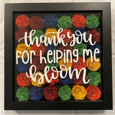 a framed sign that says, thank you for helping me season with colorful yarn flowers