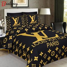 the louis vuitton paris bedding set is in black and gold with yellow letters