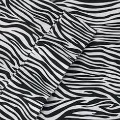 the black and white zebra print fabric has been folded up to show it's pattern